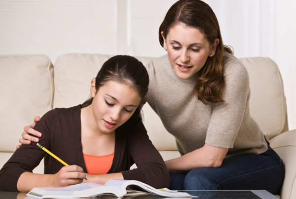 woman-helping-daughter-with-homework