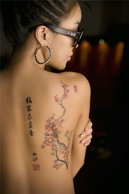 female-back-sakura-blossom-tattoo