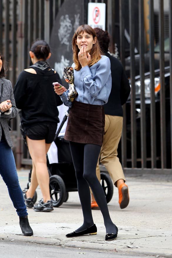 british-fashionista-alexa-chung-with-make-up-spies-photographers-and-puts-on-her-sunglasses-before-hailing-a-taxi-in-soho-in-new-york-city